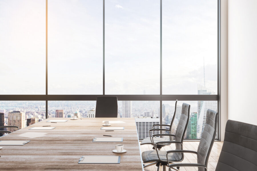 Clean meeting room interior with copy space, wooden furniture and panoramic city with sky view. 3D Rendering